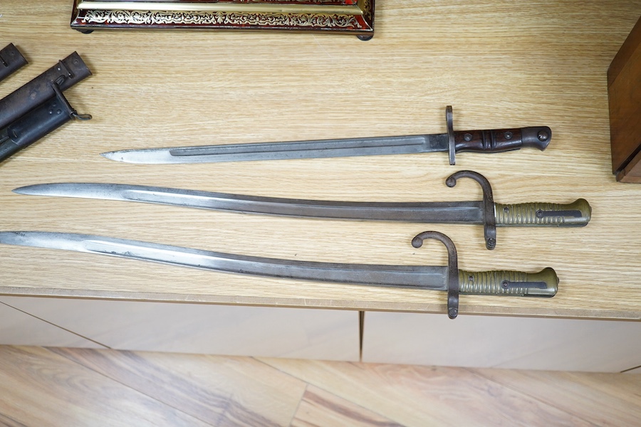 Two 19th century French bayonets and an American example, largest 71cm. Condition - fair